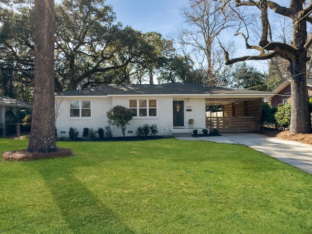 single story home with concrete driveway, crawl space, a front yard, a carport, and brick siding