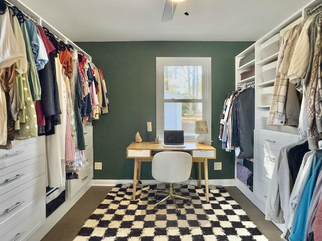 office space with ceiling fan and baseboards