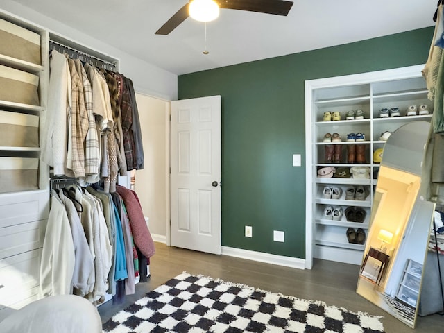 interior space with dark wood-style floors and ceiling fan