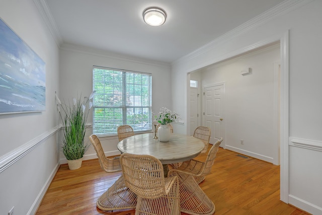 2028 Prospect Hill Dr, Mount Pleasant, SC 29464 - dining room with light wood-type flooring, ornamental molding, and baseboards