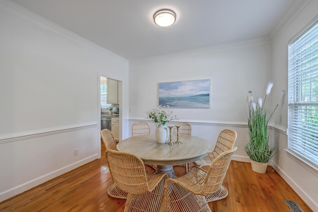 2028 Prospect Hill Dr, Mount Pleasant, SC 29464 - dining area featuring light wood finished floors, crown molding, and baseboards