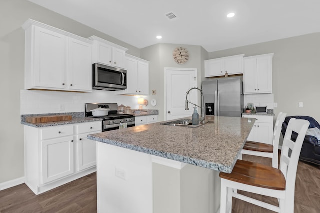 725 Pepperbush St, Charleston, SC 29414 - kitchen featuring stainless steel appliances, dark wood-style flooring, a sink, white cabinetry, and recessed lighting