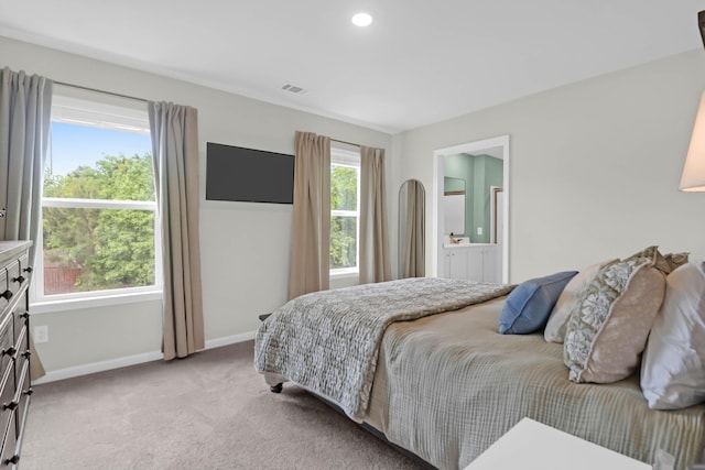 725 Pepperbush St, Charleston, SC 29414 - bedroom with baseboards, light colored carpet, and ensuite bath