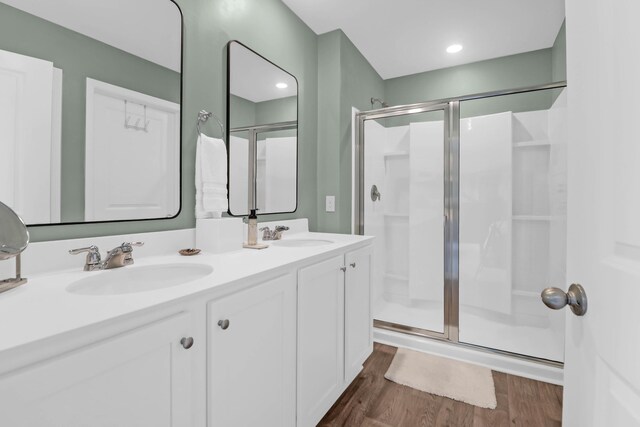 725 Pepperbush St, Charleston, SC 29414 - bathroom with a shower stall, wood finished floors, and double vanity
