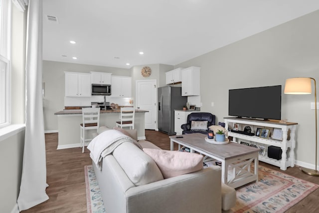 725 Pepperbush St, Charleston, SC 29414 - living area with wood finished floors, baseboards, and recessed lighting