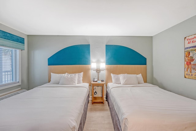 bedroom with wood finished floors