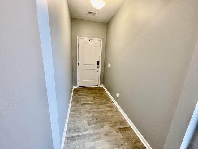 doorway to outside with light wood-type flooring