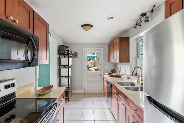 532 Sunset Dr, Charleston, SC 29407 - kitchen with black appliances, a sink, light tile patterned flooring, light countertops, and baseboards