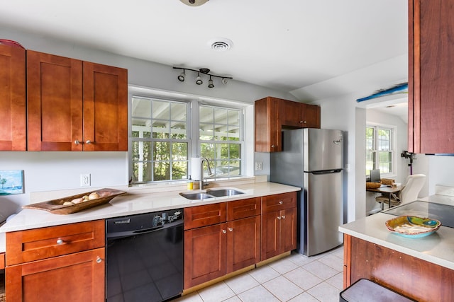 532 Sunset Dr, Charleston, SC 29407 - kitchen featuring dishwasher, a sink, freestanding refrigerator, light countertops, and light tile patterned floors