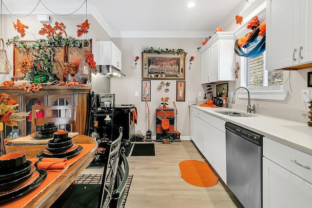 kitchen with sink, white cabinetry, crown molding, stainless steel dishwasher, and light hardwood / wood-style floors