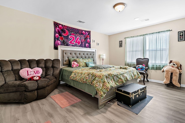 bedroom featuring hardwood / wood-style floors