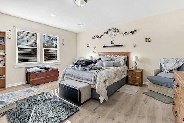 bedroom with light hardwood / wood-style floors