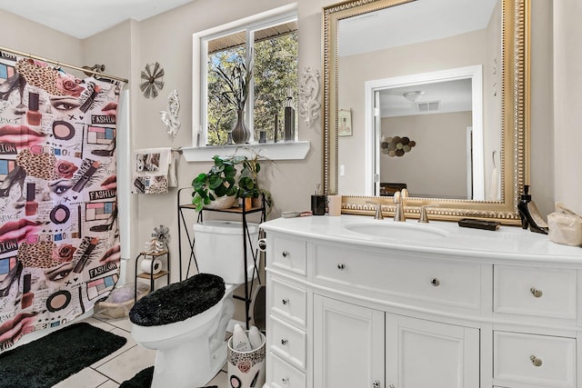 bathroom with vanity, tile patterned flooring, toilet, and a shower with shower curtain