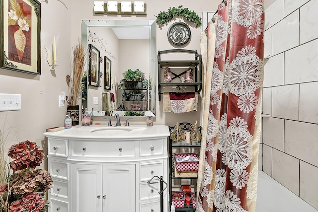 bathroom featuring vanity and a shower with shower curtain