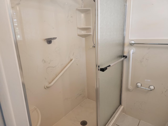 bathroom featuring tile patterned floors and walk in shower