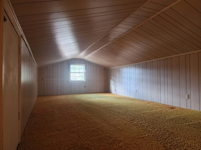 bonus room with wood ceiling, wood walls, carpet flooring, and lofted ceiling