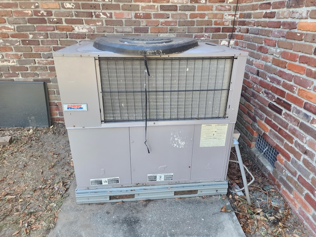 details featuring central AC and concrete flooring