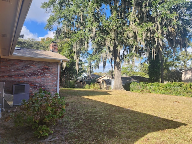 view of yard featuring central AC unit