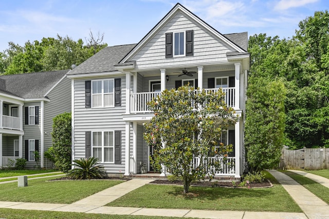 243 Old Savannah Dr, Goose Creek, SC 29445 - view of front of house with a ceiling fan, a balcony, roof with shingles, and a porch