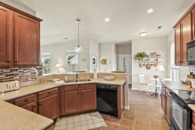 243 Old Savannah Dr, Goose Creek, SC 29445 - kitchen featuring black appliances, a sink, a peninsula, light countertops, and tasteful backsplash