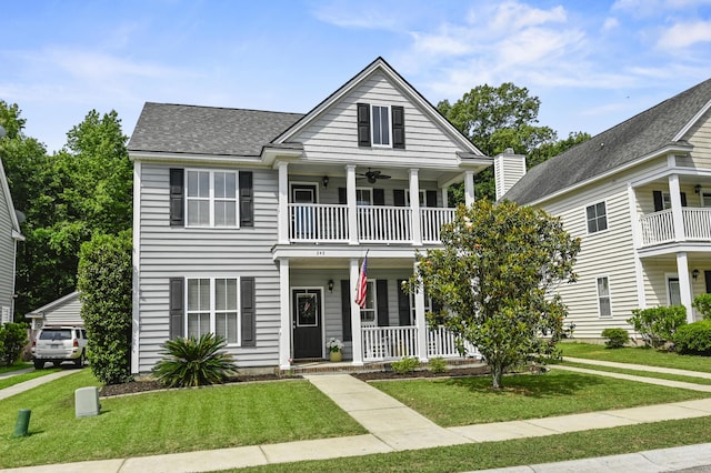 243 Old Savannah Dr, Goose Creek, SC 29445 - greek revival inspired property featuring a balcony, covered porch, a ceiling fan, and a front lawn