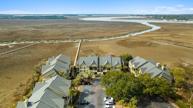 drone / aerial view with a residential view and a water view