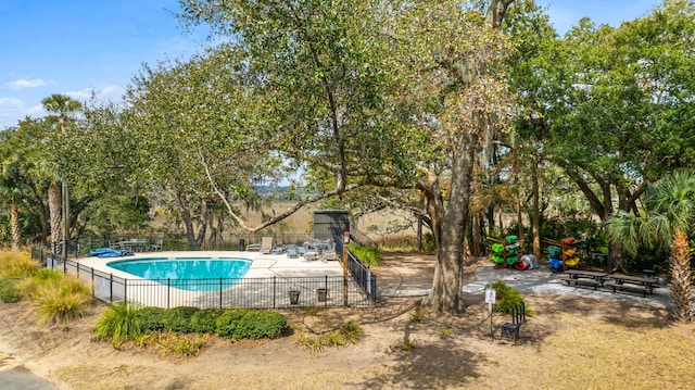 pool featuring a patio area and fence