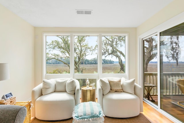 sunroom / solarium featuring visible vents