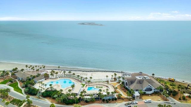 drone / aerial view featuring a water view and a beach view