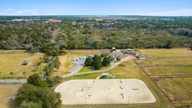 drone / aerial view featuring a forest view and a rural view