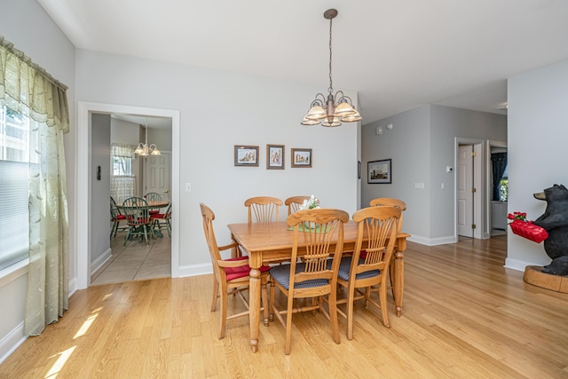 2418 Tuscany Dr, North Charleston, SC 29406 - dining space featuring baseboards, an inviting chandelier, and light wood finished floors