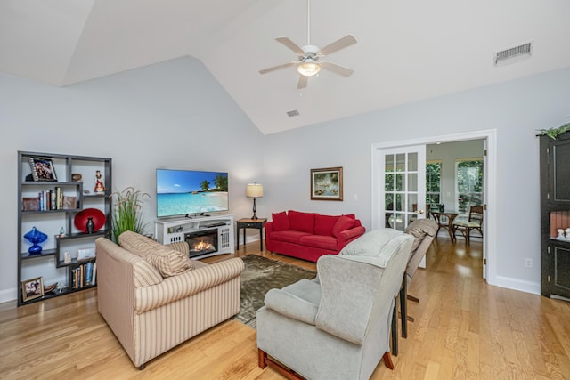 2418 Tuscany Dr, North Charleston, SC 29406 - living area with a ceiling fan, french doors, visible vents, a glass covered fireplace, and light wood-style floors