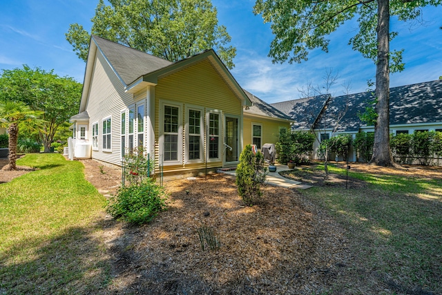 2418 Tuscany Dr, North Charleston, SC 29406 - rear view of property featuring a lawn and fence