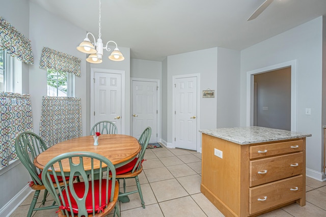 2418 Tuscany Dr, North Charleston, SC 29406 - dining room with baseboards, ceiling fan with notable chandelier, and light tile patterned flooring