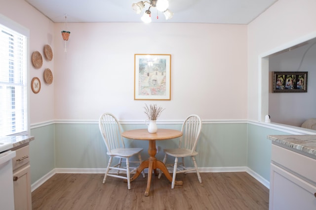 208 Owens Dr, Summerville, SC 29485 - dining area featuring light wood-style floors and a wainscoted wall