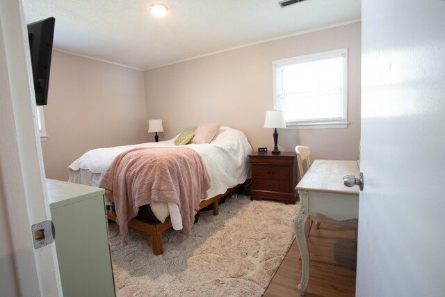 208 Owens Dr, Summerville, SC 29485 - bedroom with light wood finished floors, visible vents, and crown molding