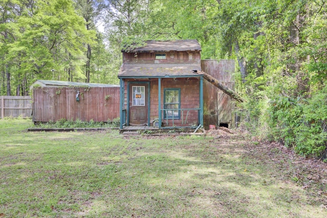 208 Owens Dr, Summerville, SC 29485 - view of outdoor structure featuring a porch, an outdoor structure, and fence