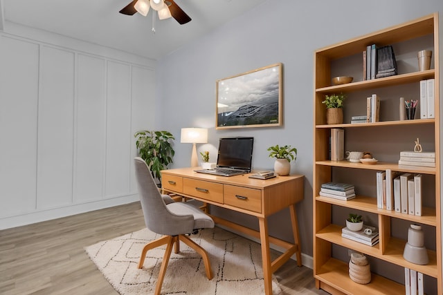 home office with ceiling fan and light wood-type flooring