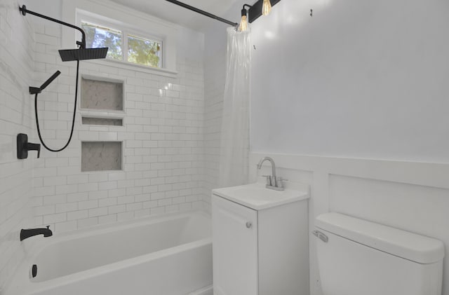 full bathroom with vanity, shower / tub combo, and toilet