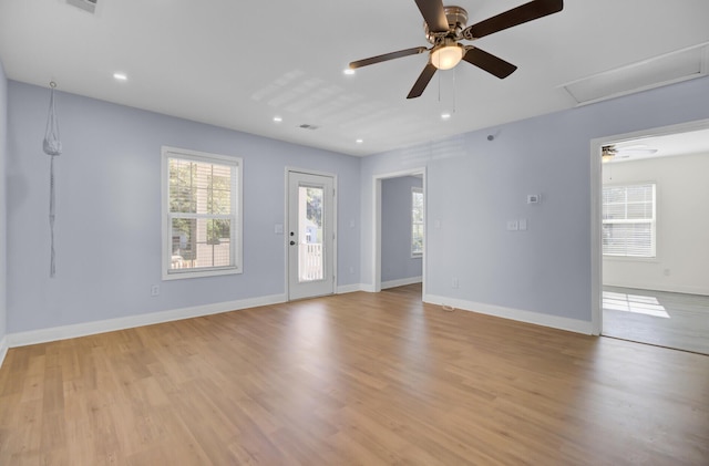 interior space featuring light hardwood / wood-style floors and ceiling fan