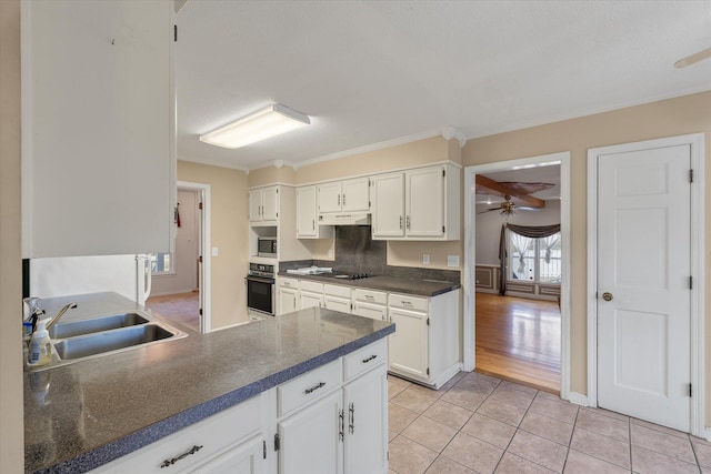 kitchen featuring black appliances, a sink, under cabinet range hood, light tile patterned floors, and ceiling fan