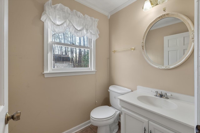 bathroom featuring tile patterned flooring, baseboards, toilet, ornamental molding, and vanity