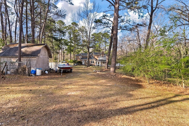 view of yard featuring a barn and an outdoor structure