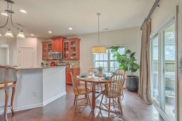 dining area with dark wood-type flooring, recessed lighting, and visible vents