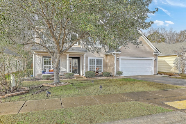 view of front facade featuring a front lawn and a garage