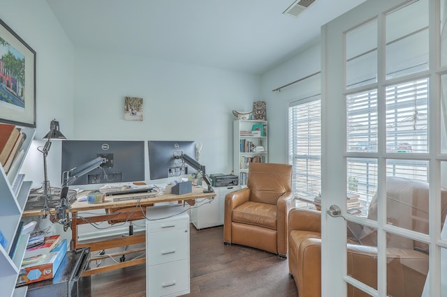 office area featuring visible vents and wood finished floors