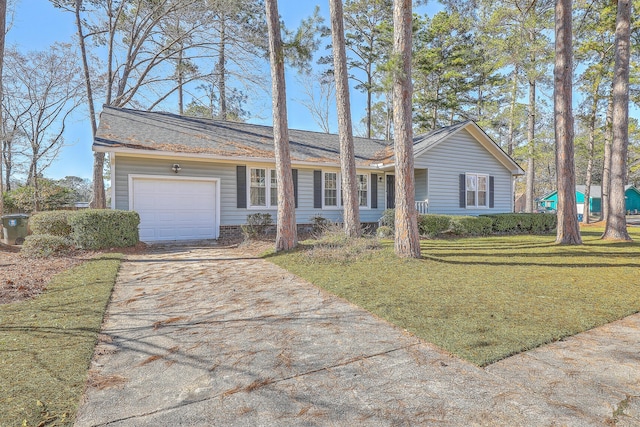 ranch-style home featuring a garage and a front lawn