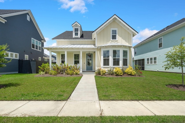 view of front of property featuring a porch and a front lawn