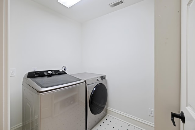 laundry area with independent washer and dryer