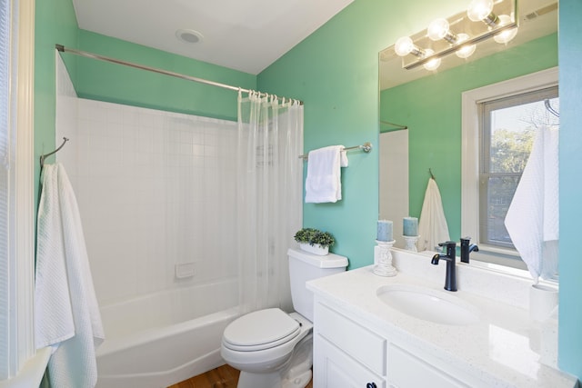 full bathroom with vanity, toilet, and shower / tub combo with curtain